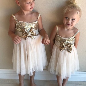 Knee length gold sequin dress hotsell