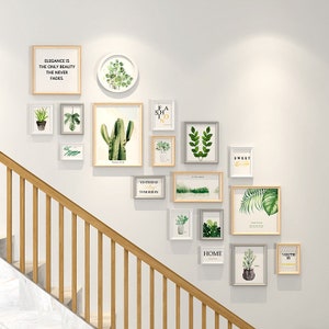 May include: A gallery wall featuring a selection of framed prints and artwork. The prints include a cactus, plants, and text such as "Sweet Dreams", "Home", "Youth is Fashion", and "Yesterday, Tomorrow".