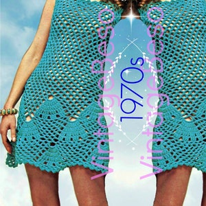 May include: A turquoise crochet mini dress with a scalloped hem. The dress is sleeveless and has a simple, open neckline. The model is wearing the dress with a gold necklace and bracelets.