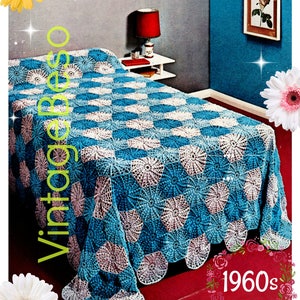 May include: A vintage crochet bedspread in shades of blue, white, and pink, with a scalloped edge. The bedspread measures 75 inches by 95 inches. The image includes the text "CRYSETTE No. 3 COTTONS" and "1960s".