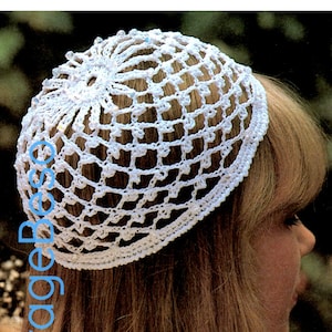 May include: A white crocheted hat with a delicate pattern. The hat is worn by a person with long brown hair. The image is labeled "1970s".