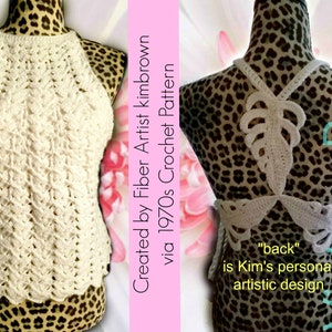 May include: A white crocheted halter top with a unique back design featuring a leaf pattern. The top is displayed on a mannequin with a leopard print base. The text "Created by Fiber Artist kimbrown via 1970s Crochet Pattern" is visible on the right side of the image. The text "back" is visible on the right side of the image. The text "is Kim's personal artistic design" is visible on the right side of the image.