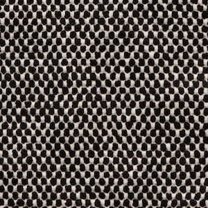 May include: Black and white textured fabric with a repeating pattern of small circles.