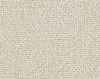 Op de afbeelding: Close-up van een beige stof met een textuur van geweven patroon.