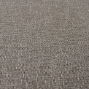 May include: A close-up of a light brown fabric with a subtle woven texture.