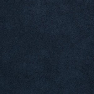 May include: A close-up of a dark blue fabric with a soft, textured surface.