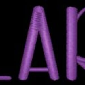 May include: Purple embroidered name "CLARK" on a black background.