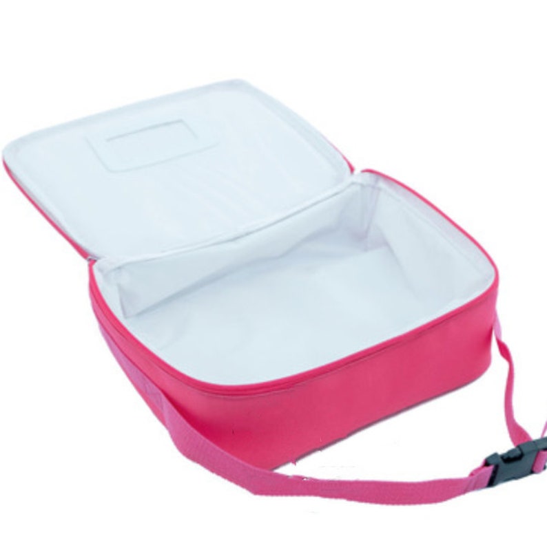 May include: A pink insulated lunch bag with a zipper closure and a shoulder strap. The bag has a white interior and a small clear window on the top.