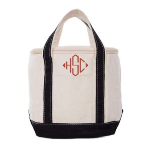May include: A white canvas cooler bag with black trim and a red monogram "HSC" on the front.