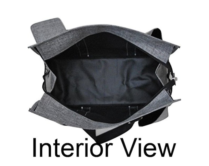 May include: Interior view of a gray and black tote bag. The bag is open, revealing a spacious black interior with multiple compartments. The exterior is a textured gray fabric. The text "Interior View" is at the bottom of the image.