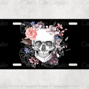 May include: A black and white skull with a floral crown of pink, purple, and blue flowers. The skull is surrounded by a black background.