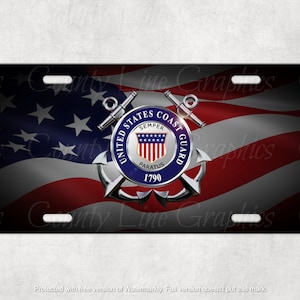 May include: A black and white license plate with a red, white, and blue American flag background. The United States Coast Guard emblem is in the center of the plate. The emblem features a silver anchor, a shield with a small American flag, and the words "United States Coast Guard" around the shield. The words "Semper Paratus" and "1790" are also on the emblem.