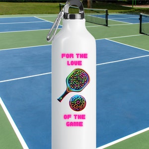 May include: White water bottle with a neon green, blue, and pink paddleball and ball graphic. The text "FOR THE LOVE OF THE GAME" is printed on the bottle in pink.