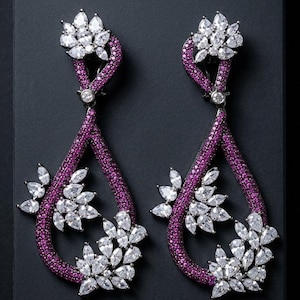 May include: A white ceramic mug with a black handle and the text "But First, Coffee" in a handwritten style. The mug is on a white surface. The mug is 4 inches tall.