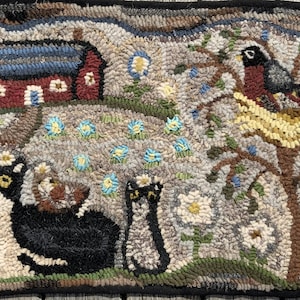May include: A hand-hooked rug featuring a red barn with a blue roof, two black cats, a bird's nest with a robin and a baby bird, and a field of white and blue flowers.