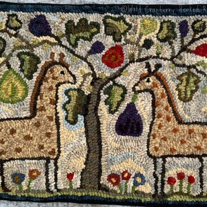 May include: A hooked rug depicting two giraffes standing under a tree with fruit. The rug is made with a variety of colors and textures, including brown, green, red, and blue.