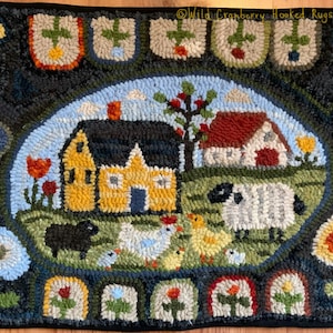 May include: A hooked rug featuring a yellow house with a red roof, a white barn, a sheep, a black dog, and chickens in a green field. The rug is bordered by flowers and leaves.