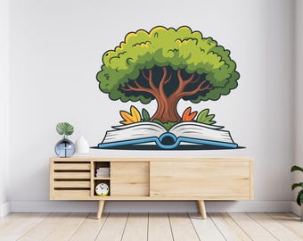 May include: A whimsical illustration of a tree growing out of an open book. The tree has a green, leafy canopy and a brown trunk. The book is open, with white pages and a blue spine. The image is a wall decal.
