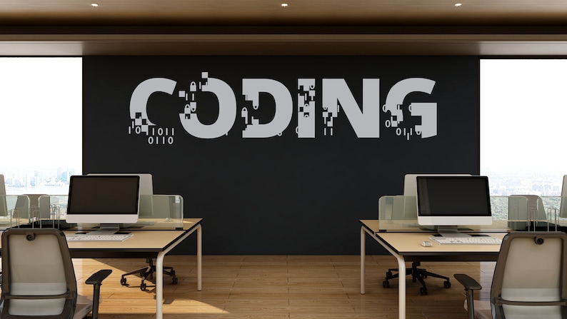 May include: A modern office space with two computer workstations and a black wall with the word "CODING" written in white, with a pixelated effect.