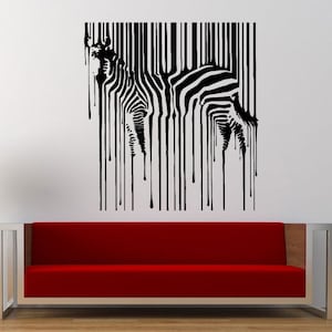 May include: Black and white zebra silhouette with dripping lines, resembling a barcode, on a white wall. The zebra is positioned above a red couch.