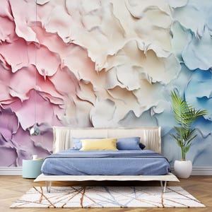 May include: A bedroom with a bed and a plant. The wall behind the bed is covered in a colorful abstract wallpaper with pink, white, and blue hues. The wallpaper has a textured, 3D effect.