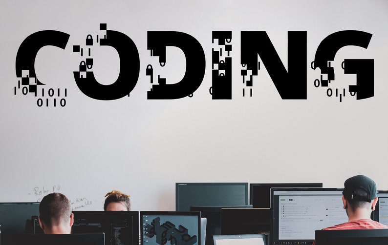 May include: The word "CODING" is written in black on a white wall, with some of the letters broken up into pixelated blocks.  Three people are sitting in front of computers, working on a project.