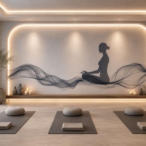 May include: A serene yoga studio with three yoga mats, cushions, and folded towels. A wall mural depicts a meditating figure with flowing lines. The room features neutral tones, candles, and a large window overlooking a body of water.