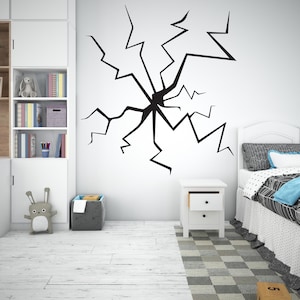 May include: Black and white wall decal of a cracked wall with a spiderweb-like pattern. The decal is applied to a white wall in a child's bedroom.