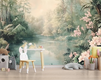 May include: A serene mural depicts a lush jungle scene with a river, trees, and flowers. A white table and chair set, along with stuffed animals and decorative blocks, are arranged in front of the mural. A plush gray animal is on the floor.