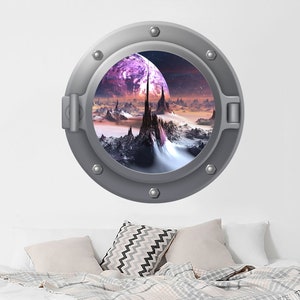 May include: A silver porthole wall decal with a view of a fantastical landscape with a purple planet and a rocky mountain range.