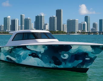 May include: A white and blue motorboat with a distinctive blue and teal camouflage pattern on the hull floats on turquoise water. The boat has a sleek design with a white cabin and is set against a backdrop of a city skyline under a blue sky.