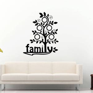 May include: Black and white family tree wall decal with the word "family" and six circles for photos.
