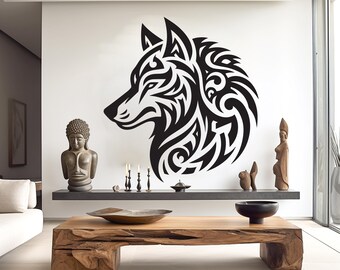 May include: Black and white tribal wolf head wall decal. The wolf is stylized with intricate patterns and details. The decal is shown on a white wall in a living room setting.