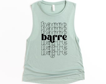May include: A light blue sleeveless muscle tank top with the word "barre" printed in black letters in a retro style.