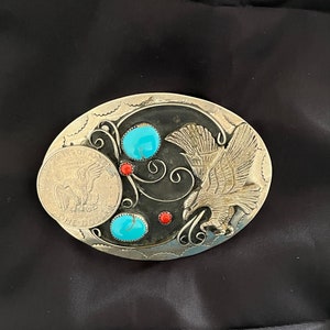 Vintage  German Silver belt buckle with a turquoise, coral, dollar, and an eagle