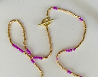 Pink or Violet Miyuki  beads necklace ended with a medallion.