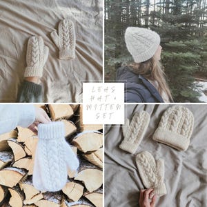 May include: A white knit hat and matching mittens. The hat has a cable knit pattern and the mittens have a fold-over cuff. The text "LEAS HAT & MITTEN SET" is visible in the image.