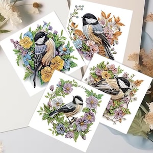 May include: Four square cards featuring detailed illustrations of chickadees surrounded by colorful floral arrangements. The birds have black and white heads, gray and tan bodies, and are perched among yellow, blue, and purple flowers.