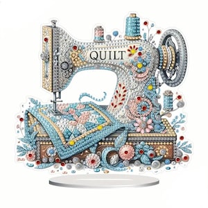 May include: A decorative sewing machine with the word "QUILT" on it. The machine is embellished with colorful gems and floral designs. A small quilt rests on the machine's base, and the color palette includes blue, pink, and gold.