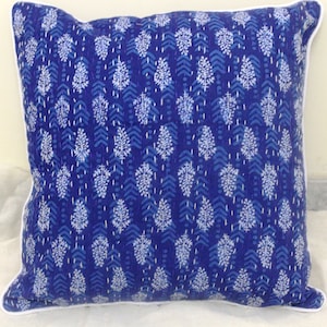 May include: Blue and white patterned cotton cushion cover with a white border. The pattern features a repeating design of small white leaves on a blue background.