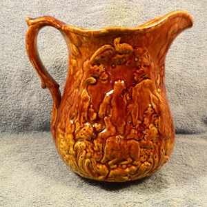 Rockingham Bennington Yellow Ware Hunting Scene Pitcher
