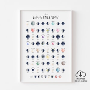 Puede incluir: Una impresión enmarcada del Calendario Lunar 2016. El calendario muestra las fases de la luna en una cuadrícula, cada fase representada por una ilustración en acuarela. El título "Lunar Calendar" está en la parte superior. La impresión incluye una leyenda en la parte inferior.