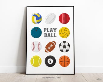 May include: A framed wall art print featuring a grid of various sports balls including a volleyball, rugby ball, cricket ball, bowling ball, water polo ball, baseball, football, soccer ball, tennis ball, 8-ball, and basketball with the text PLAY BALL.