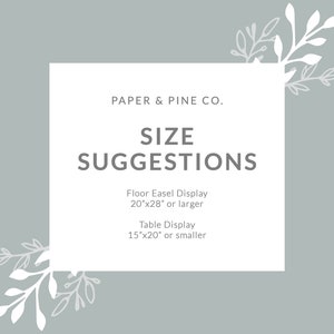 Puede incluir: Un rect&aacute;ngulo blanco con texto gris sobre un fondo gris claro. El texto dice "PAPER & PINE CO. SIZE SUGGESTIONS Floor Easel Display 20"x28" or larger Table Display 15"x20" or smaller". El rect&aacute;ngulo est&aacute; rodeado de dise&ntilde;os florales blancos.