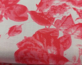 May include: White fabric with a pink floral print. The fabric features a repeating pattern of large pink roses and leaves.