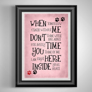 May include: Pink background with black text that reads "When tomorrow starts without me don't think we're far apart for every time you think of me I am right here inside your heart". There are two paw prints at the top and two paw prints at the bottom of the text.