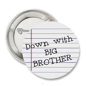 May include: A white button with blue lines and red lines, resembling notebook paper. The text "Down with Big Brother" is written in black.