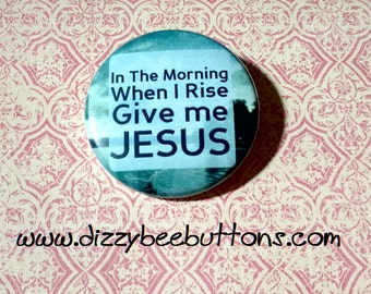 May include: A blue and white button with the text "In The Morning When I Rise Give me JESUS".