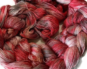 Hand-dyed pre-wound weaving warps, 8/2 rayon, 3 7/8 yards, multiple ends, in shades of red, red brown, pink, peach, silver, and grey -DW277