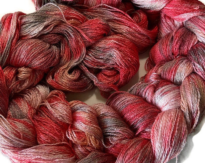 Hand-dyed pre-wound weaving warps, 8/2 rayon, 3 7/8 yards, multiple ends, in shades of red, red brown, pink, peach, silver, and grey -DW277